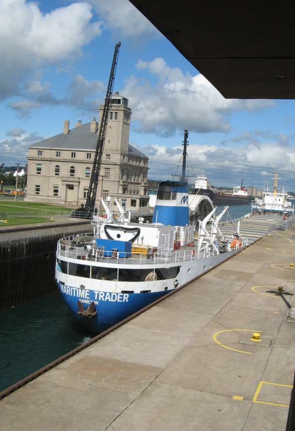 'Maritime' Freighter Dropped 21 Feet for Entry to Lake Huron (note its deck level with dock's deck level)